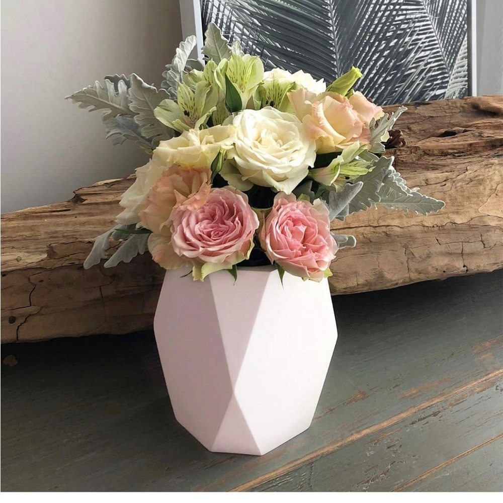 White vase for flowers (not included)
